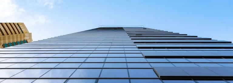 UAE freezone corporate tax — professional flat lay with orange pen and documents